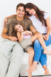 Cute family sitting together on a sofa