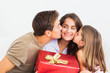 Father and his daughter offering a red gift