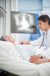 Doctor auscultating a patient with a stethoscope