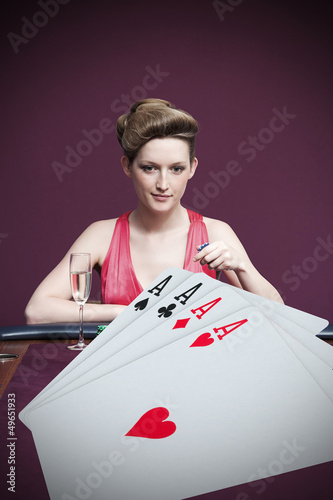 Photo: Woman playing roulette with champagne Woman playing roulette with champagne