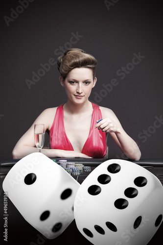 Photo: Woman playing roulette with champagne Woman playing roulette with champagne