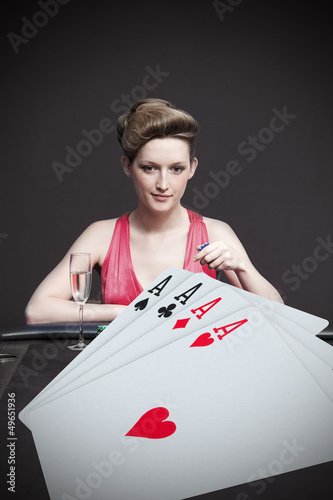 Photo: Woman playing roulette with champagne Woman playing roulette with champagne