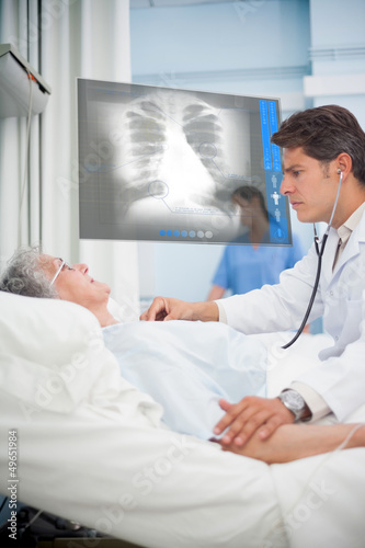 Photo: Doctor auscultating a patient with a stethoscope Doctor auscultating a patient with a stethoscope