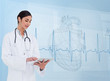 Cheerful cardiologist using a tablet pc