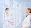 Women doctors using futuristic interfaces
