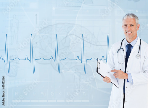 Photo: Portrait of senior cardiologist using a clipboard Portrait of senior cardiologist using a clipboard
