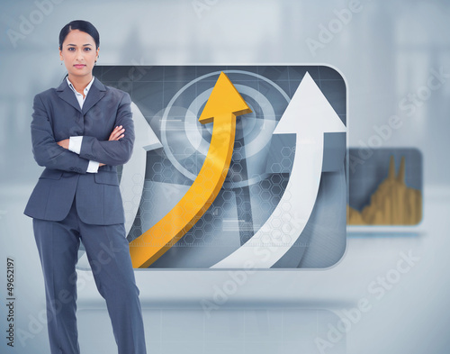 Photo: Stern businesswoman standing looking at camera Stern businesswoman standing looking at camera