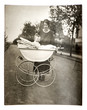 mother with baby in vintage buggy