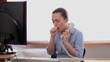 Sick woman coughing in the office
