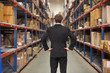 Rear View Of Manager In Warehouse