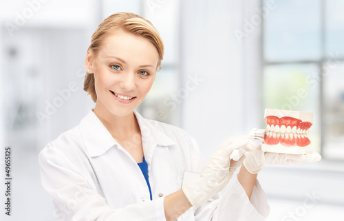 Photo: doctor with toothbrush and jaws doctor with toothbrush and jaws