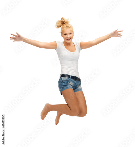 Photo: jumping teenage girl in blank white t-shirt jumping teenage girl in blank white t-shirt