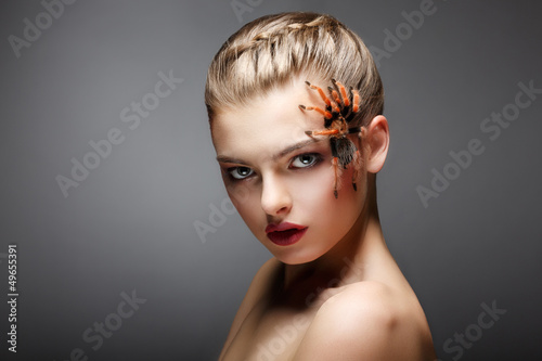 Photo: Spider-Girl Fashion Model with Poisonous Spider on her Face Spider-Girl Fashion Model with Poisonous Spider on her Face