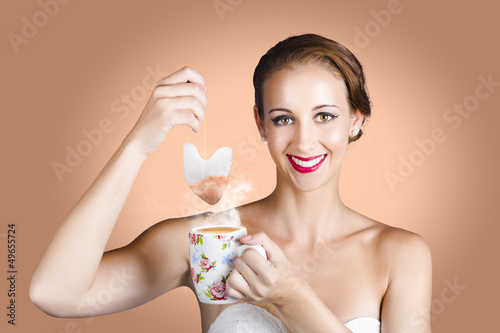 Photo: Happy Beautiful Pin Up Girl Drinking Tea Or Coffee Happy Beautiful Pin Up Girl Drinking Tea Or Coffee