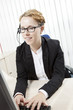 Secretary typing on her computer
