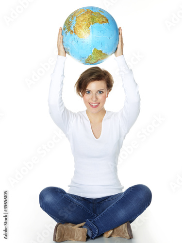 Photo: Woman holds the world globe over her head Woman holds the world globe over her head