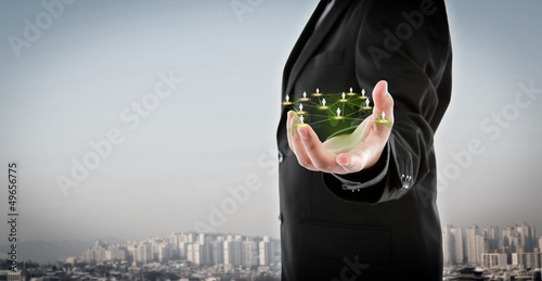 Photo: Business man hold social network Business man hold social network