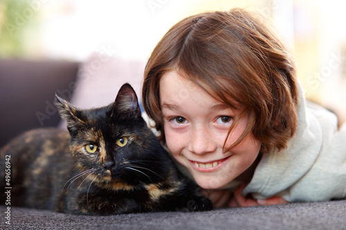 Photo: Young boy with cat Young boy with cat
