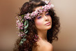 Nymph. Sensual Brunette with Garland of Flowers looks like Angel