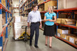 Businesswoman And Colleague In Distribution Warehouse