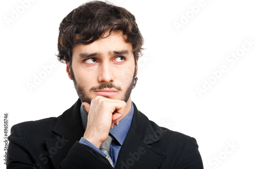 Photo: Thoughtful young businessman portrait isolated on white Thoughtful young businessman portrait isolated on white