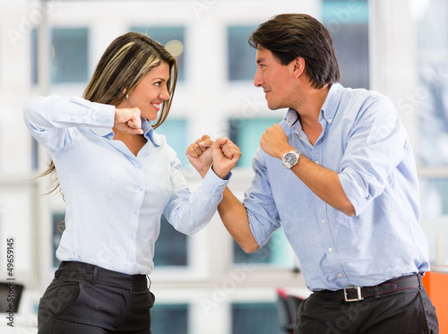Photo: Competitive business couple Competitive business couple