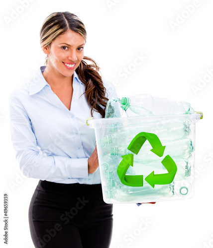 Photo: Woman recycling Woman recycling