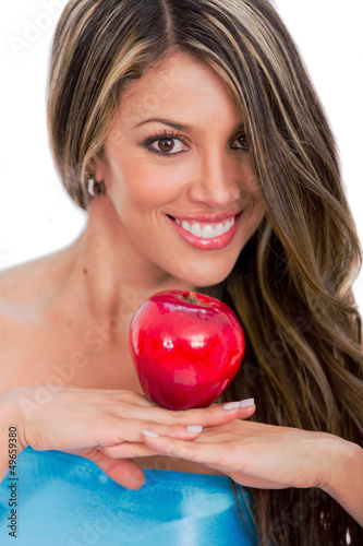 Photo: Beautiful woman holding an apple Beautiful woman holding an apple