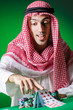 Arab playing in casino - gambling concept with man