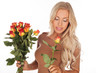 Beautiful woman with a bouquet of roses