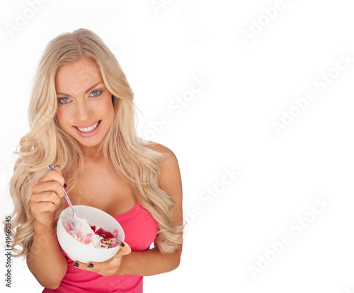 Photo: Attractive fit young woman eating ice cream Attractive fit young woman eating ice cream