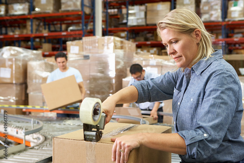 Photo: Workers In Distribution Warehouse Workers In Distribution Warehouse