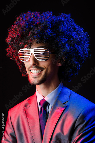 Photo: Singer with afro cut in dark studio Singer with afro cut in dark studio