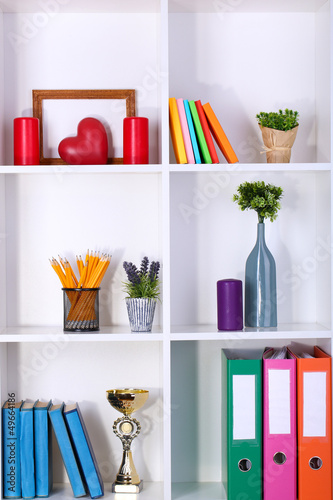 Photo: Beautiful white shelves with different home related objects Beautiful white shelves with different home related objects