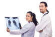 Two doctors looking at x-ray image on white