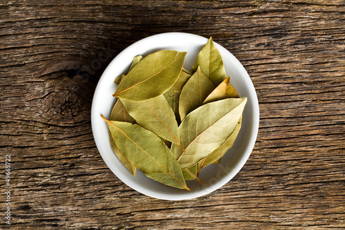 Photo: bay leaves in ceramic bowl bay leaves in ceramic bowl