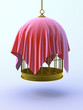 Birdcage suspended with red drape
