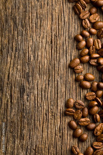 Photo: coffee beans on vintage wooden background coffee beans on vintage wooden background
