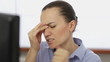 Young woman with headache, close up