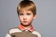 Handsome little boy in cardigan