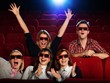 Group of people in 3D glasses watching movie in cinema