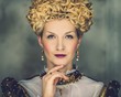 Portrait of beautiful haughty queen in royal dress