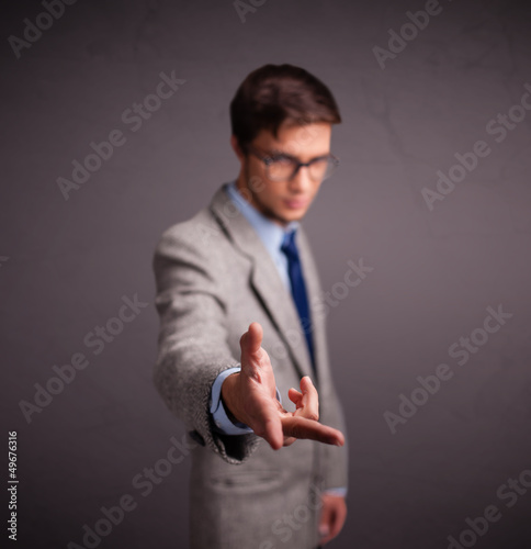 Photo: Young man standing and throwing something Young man standing and throwing something