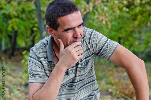 Photo: Man thinking outdoor Man thinking outdoor