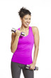 Young woman exercising holding dumbbells