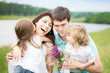 Happy family in spring field