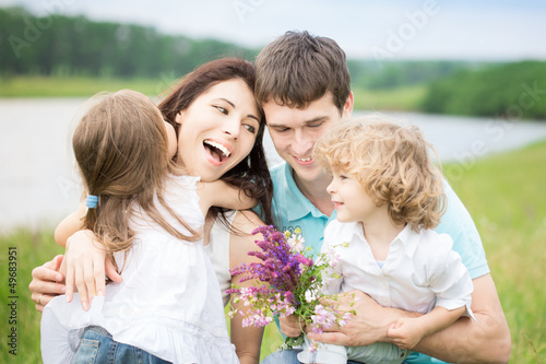 Photo: Happy family in spring field Happy family in spring field