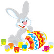 Easter Bunny decorating a big Easter egg