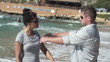 Video: Couple fighting on the beach, super slow motion Couple fighting on the beach, super slow motion