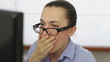 Shocked business woman in front of computer, close up